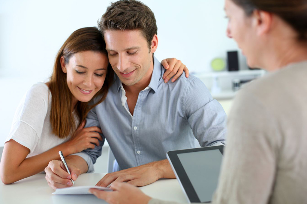 Couple signing real-estate contract