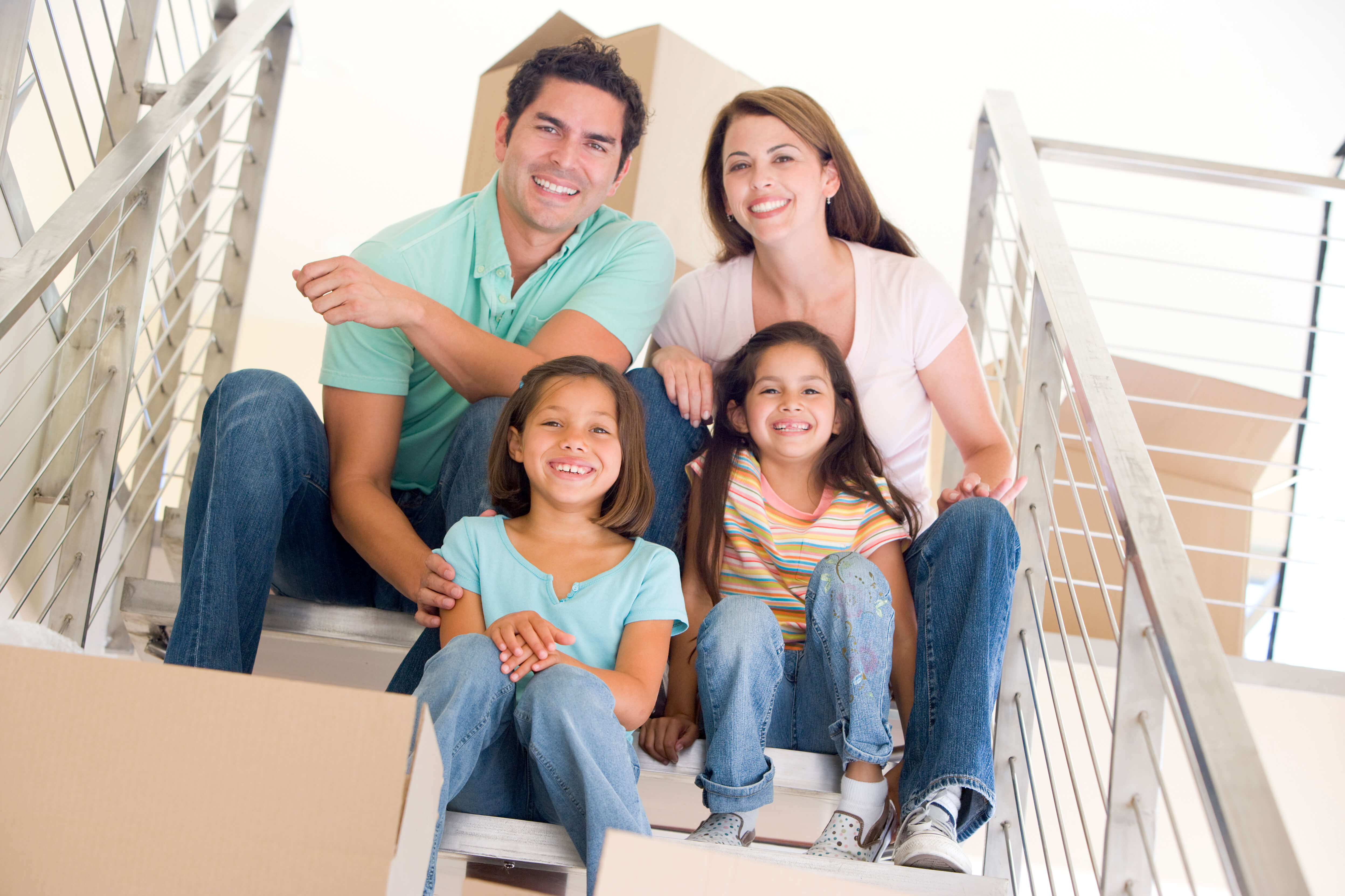 Happy Family Seating on the Stairs